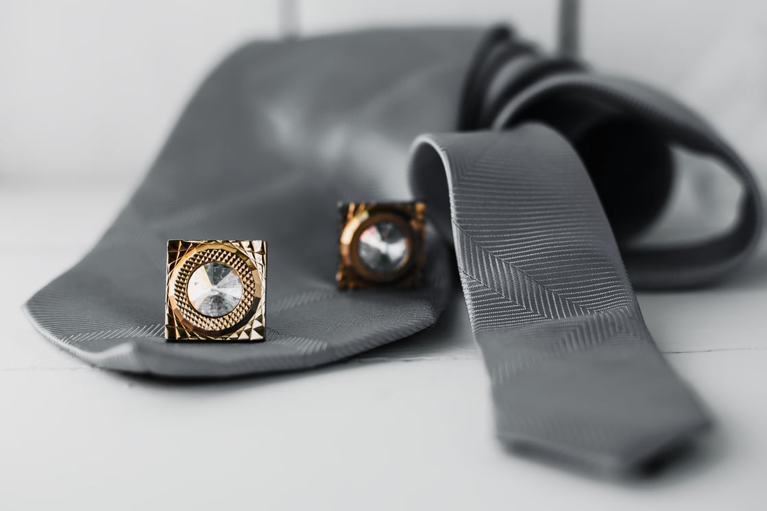 Gray necktie and cufflinks